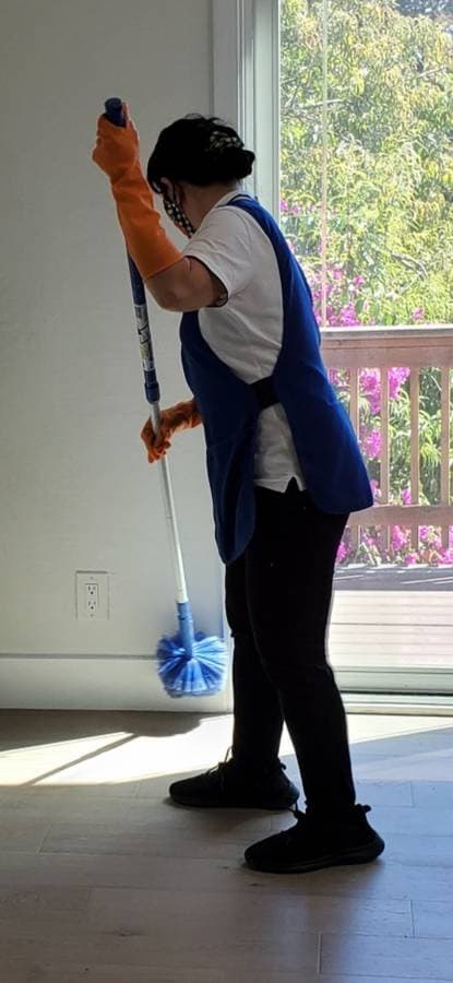 Mopping interior floors as part of move-in cleaning service